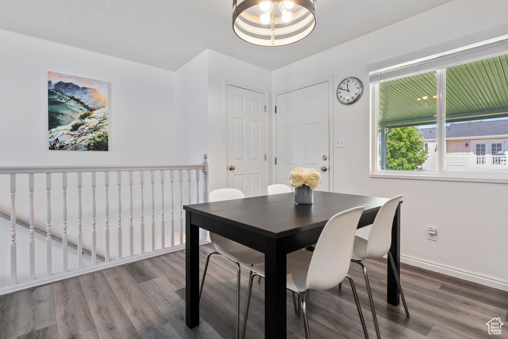 Dining space with wood finished floors and baseboards