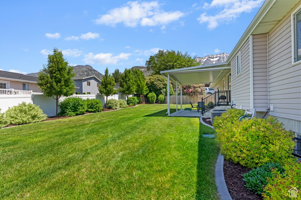 View of yard with a patio area and a mountain view