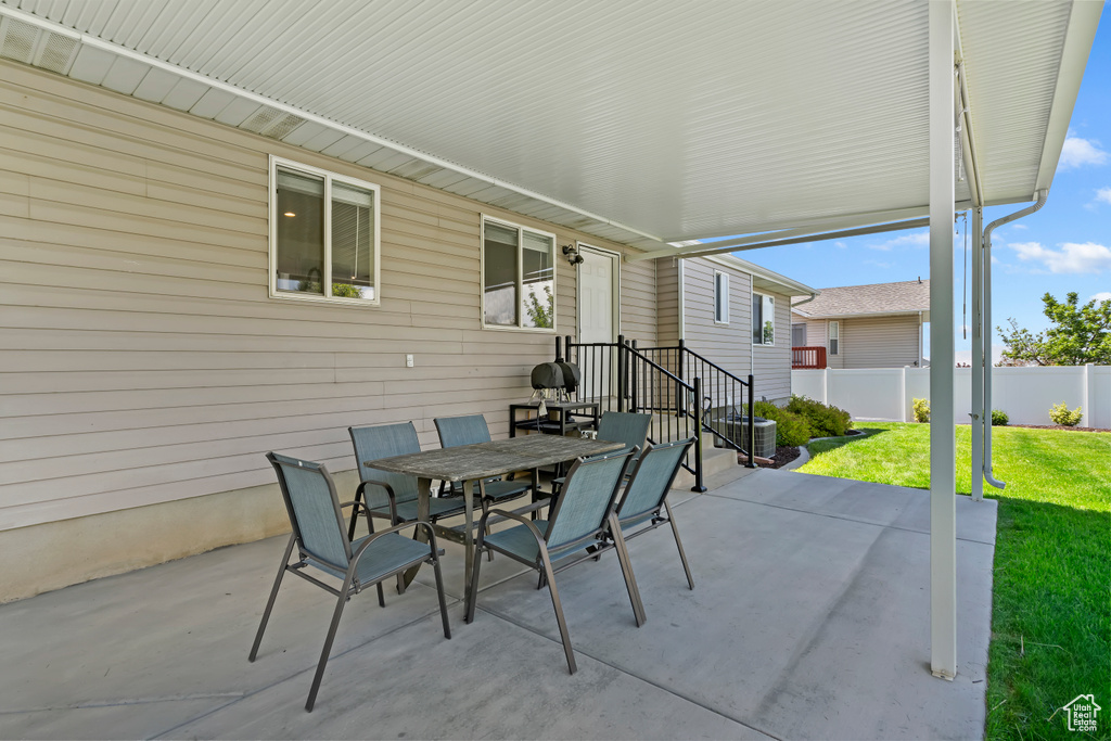 View of patio with outdoor dining area