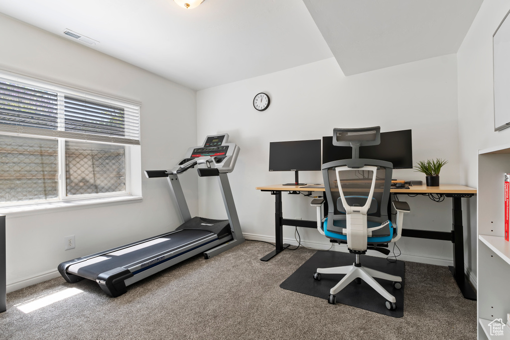 Carpeted office featuring baseboards