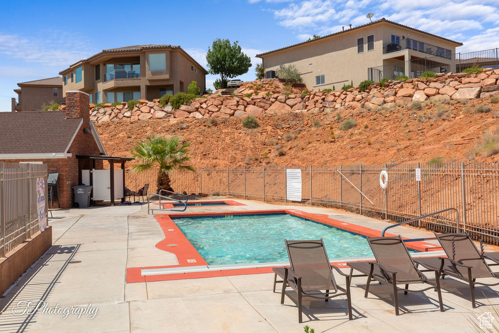 Community pool featuring a patio