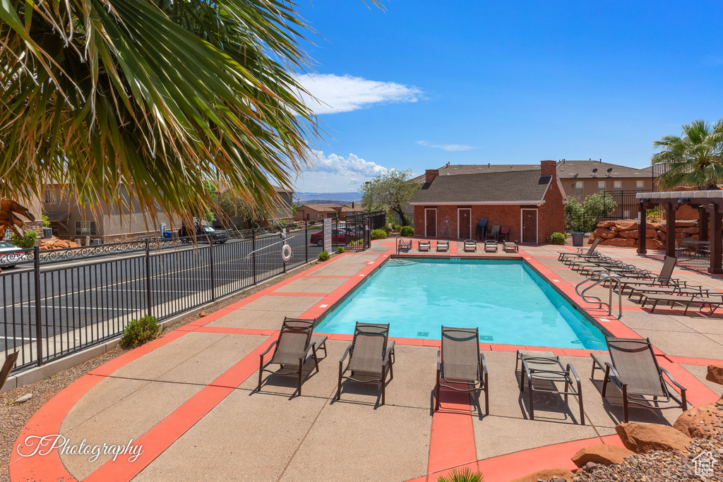 Community pool featuring a patio