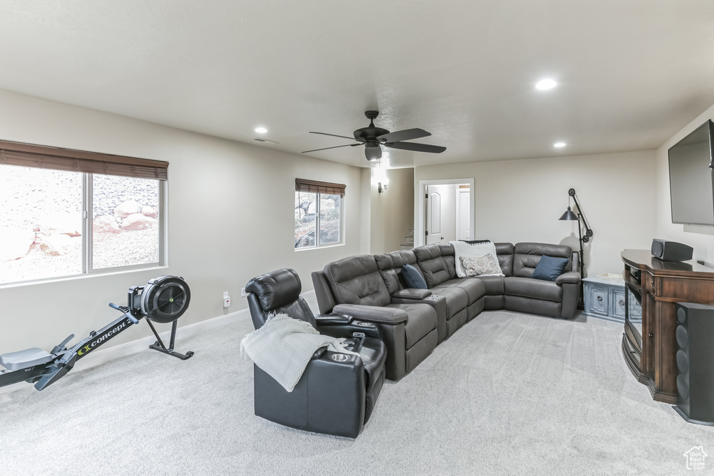 Living room with light colored carpet, recessed lighting, ceiling fan, and baseboards