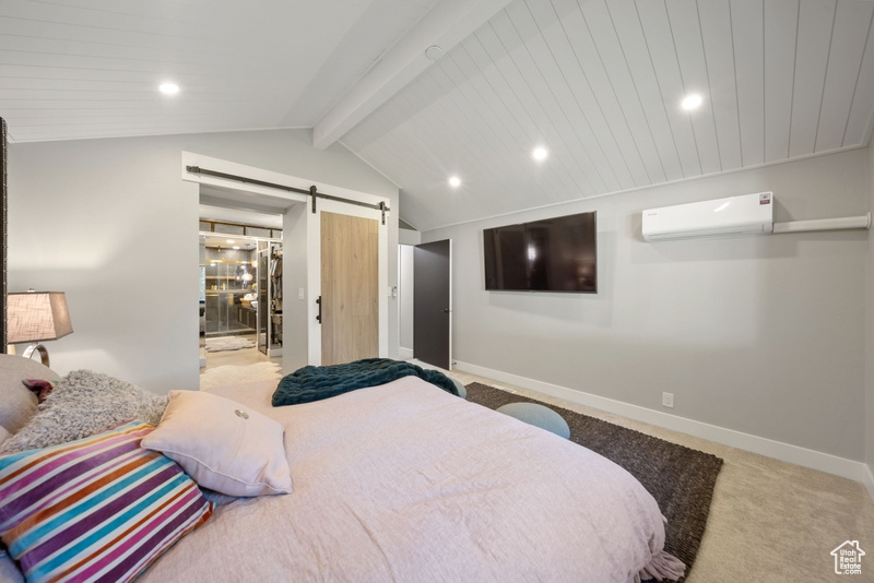 Carpeted bedroom with a wall unit AC, a barn door, baseboards, and recessed lighting