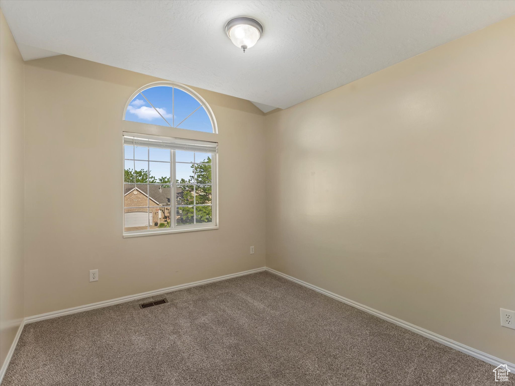 Spare room with carpet flooring and baseboards