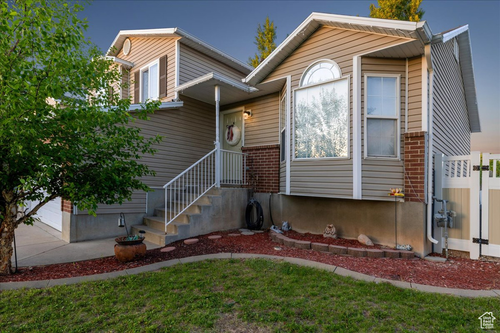 View of front of home featuring brick siding