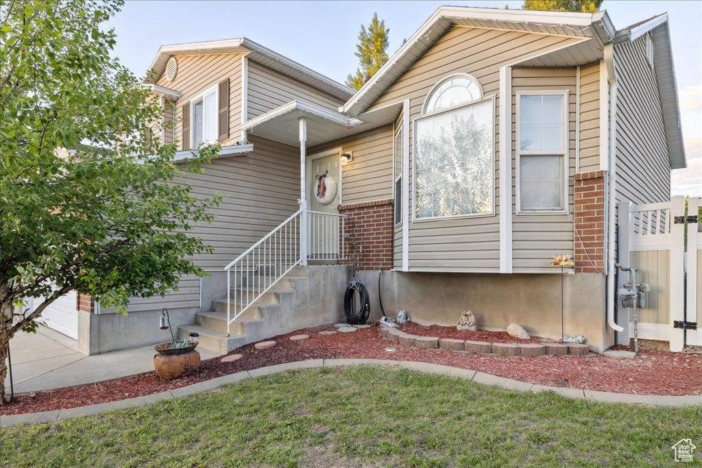 View of front of property with brick siding