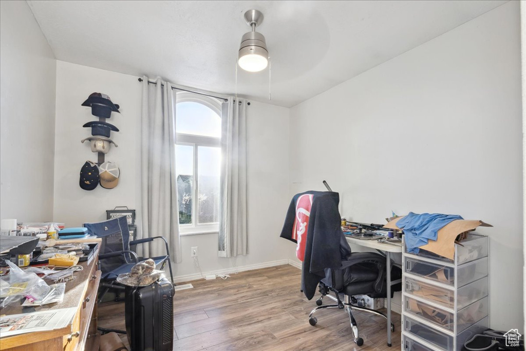 Office featuring wood finished floors, ceiling fan, and baseboards