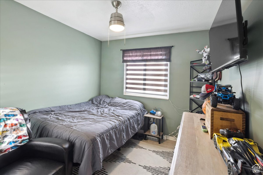 Bedroom with wood finished floors