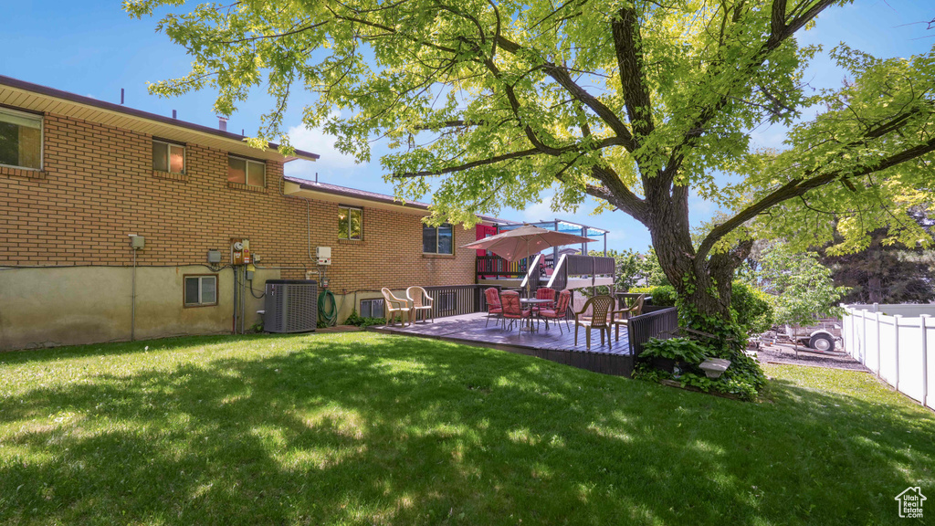 View of yard featuring central AC unit and a patio area