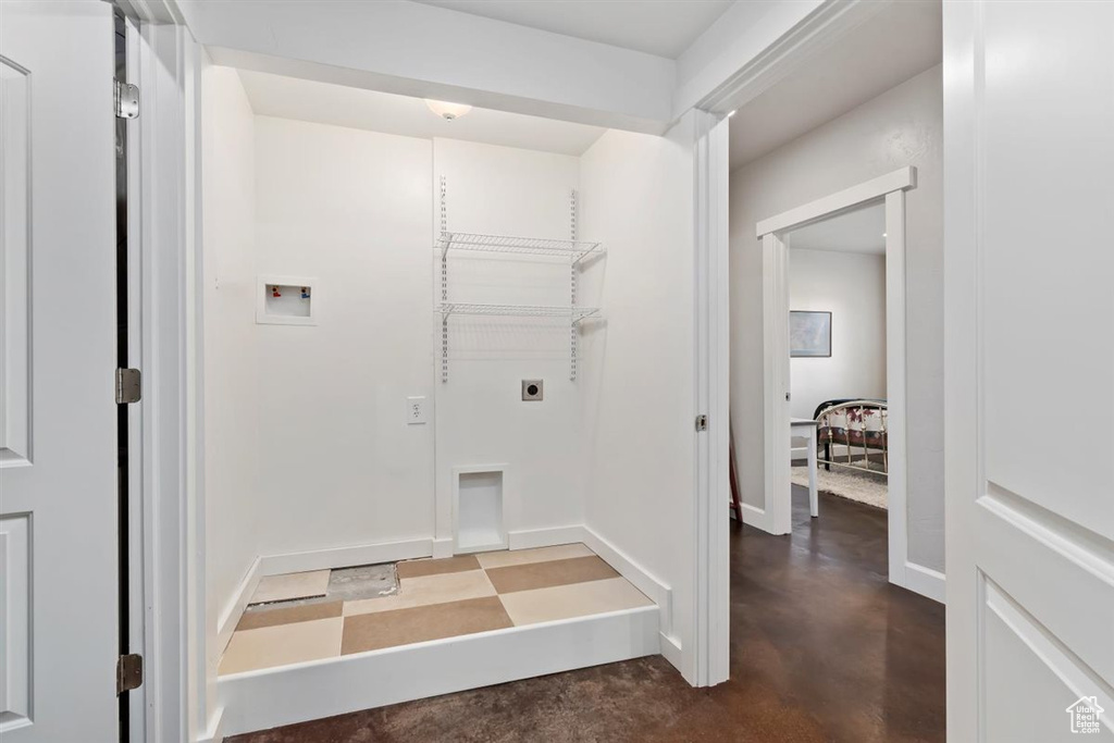 Laundry room featuring electric dryer hookup, baseboards, and washer hookup