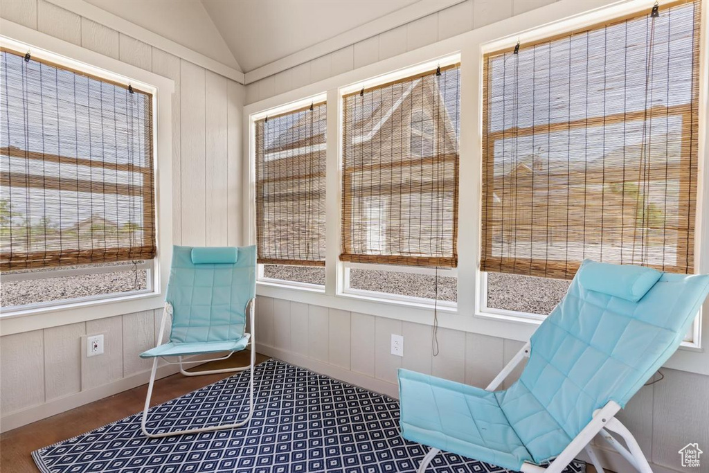 Sunroom / solarium featuring vaulted ceiling
