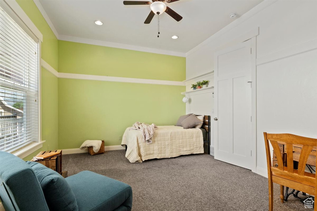 Carpeted bedroom featuring a ceiling fan, recessed lighting, crown molding, and baseboards
