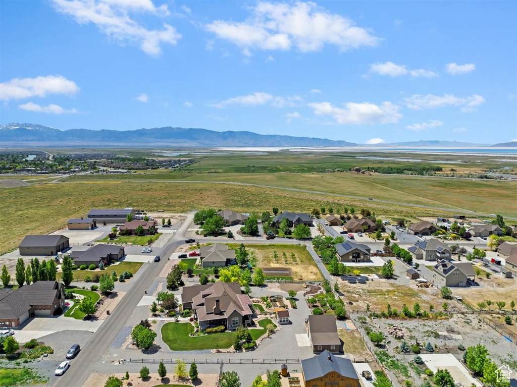 Aerial view of residential area featuring a mountainous background