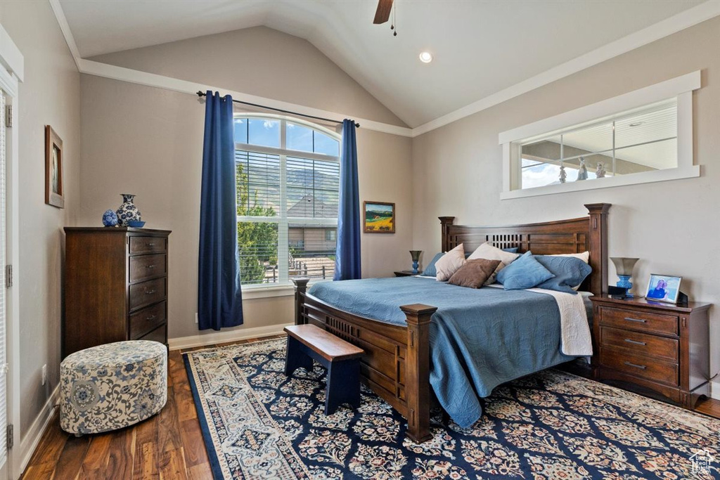Bedroom with wood finished floors, lofted ceiling, baseboards, recessed lighting, and ceiling fan