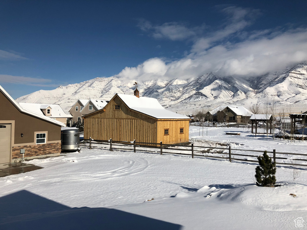 Snowy yard with a mountain view