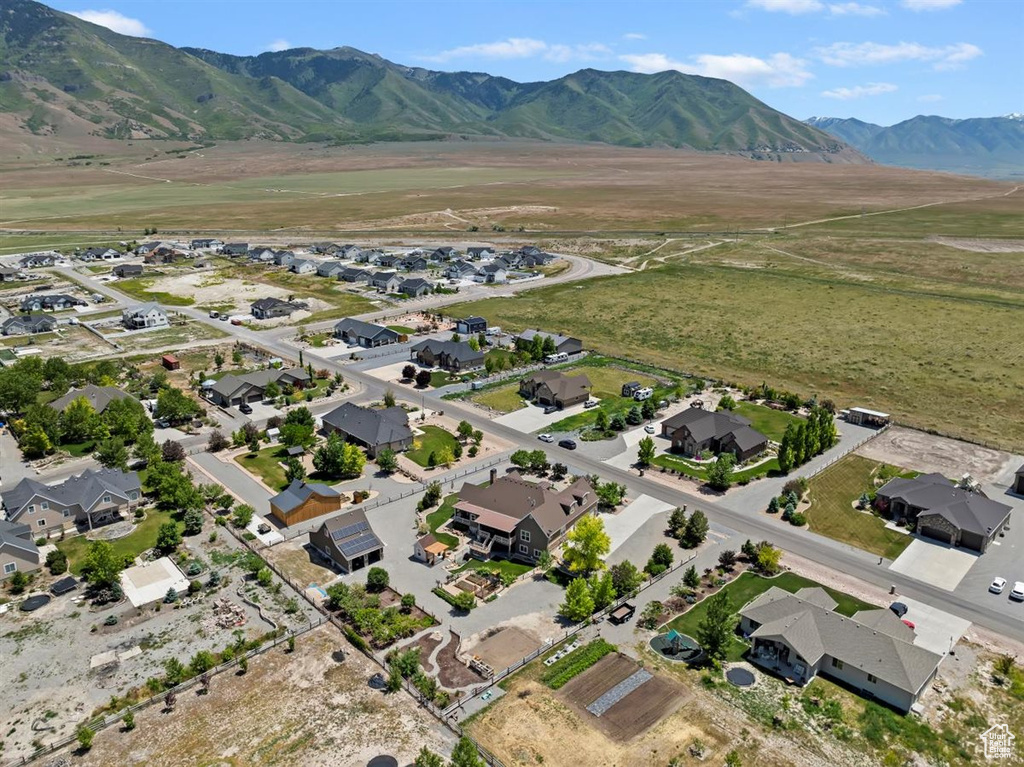 View of property location with mountains and nearby suburban area