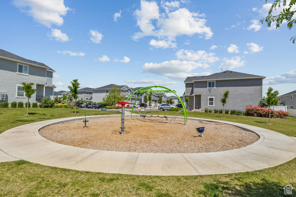 Surrounding community featuring a residential view and a lawn
