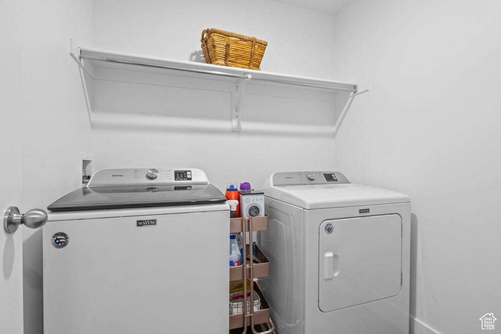 Laundry room featuring washer and clothes dryer