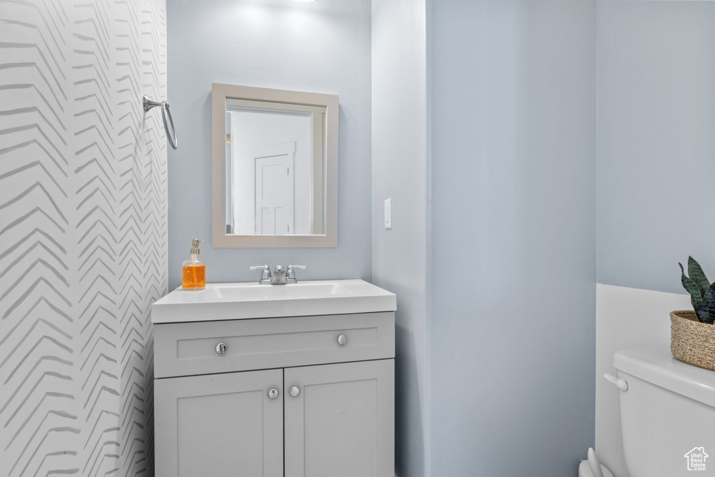 Bathroom with toilet and vanity