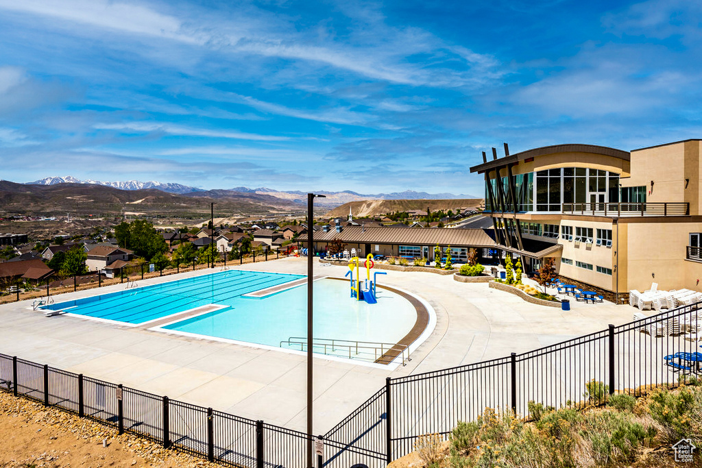 Community pool with a mountain view