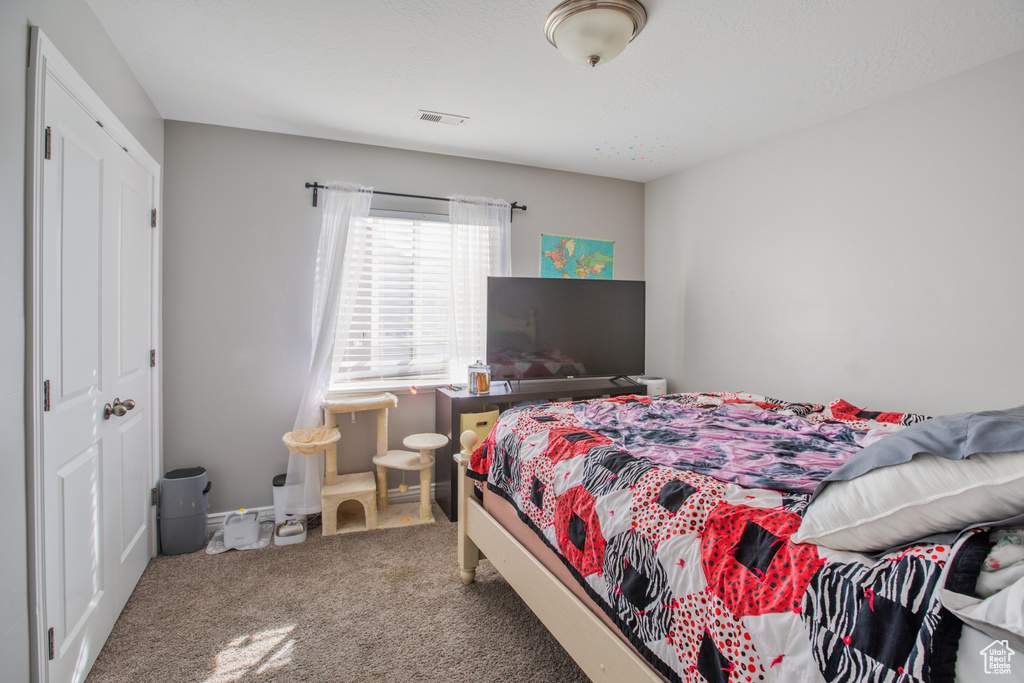 Bedroom featuring carpet