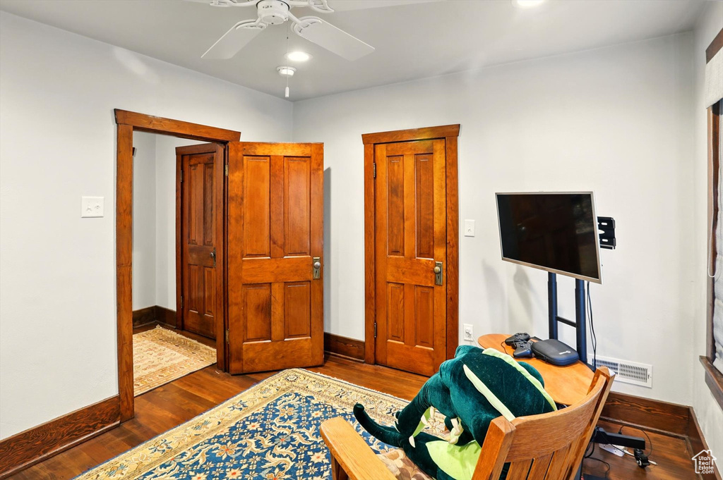 Office with baseboards, dark wood-style flooring, ceiling fan, and recessed lighting