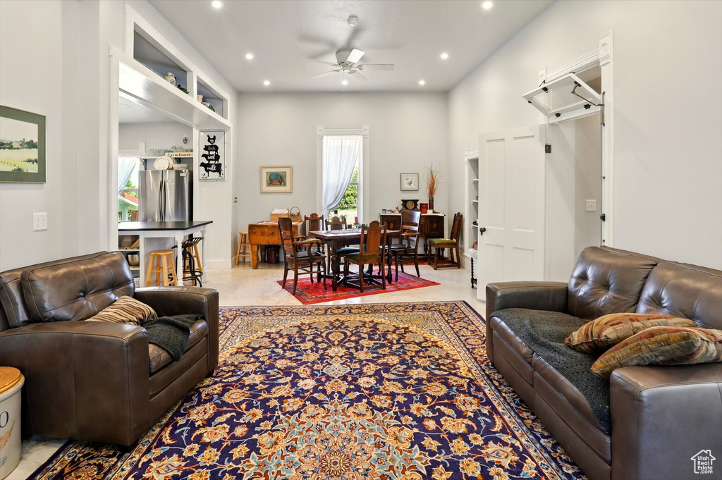 Living room featuring ceiling fan and recessed lighting