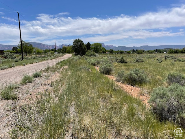 View of mountain background featuring rural landscape