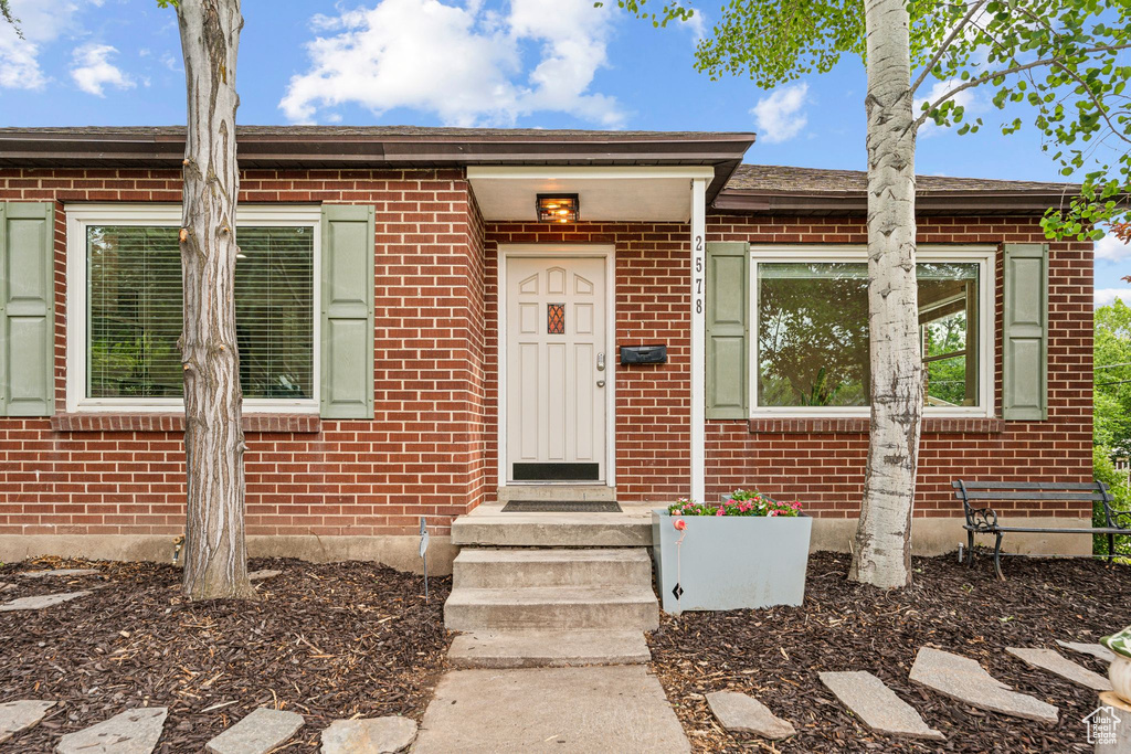 Property entrance with brick siding