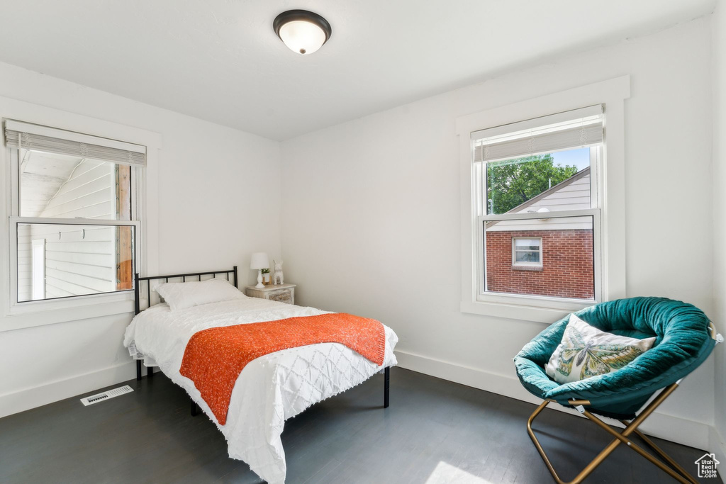 Bedroom featuring baseboards and wood finished floors