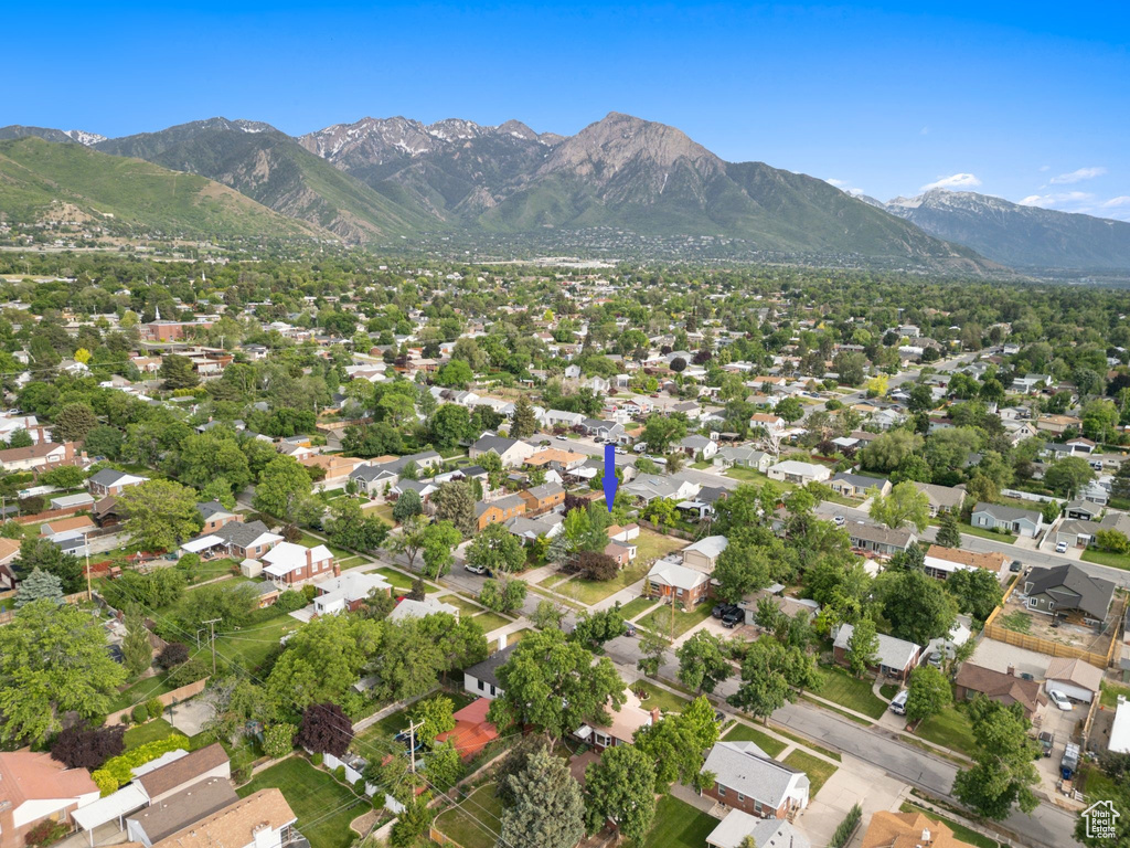 View of property location with a mountain backdrop and nearby suburban area