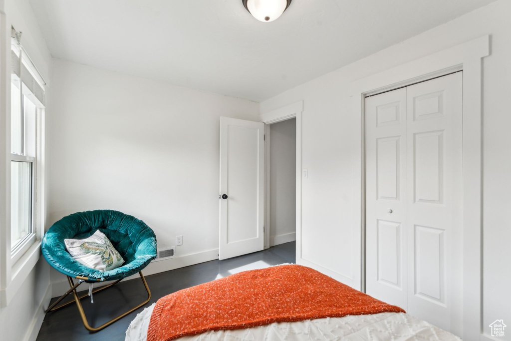 Bedroom featuring baseboards and a closet