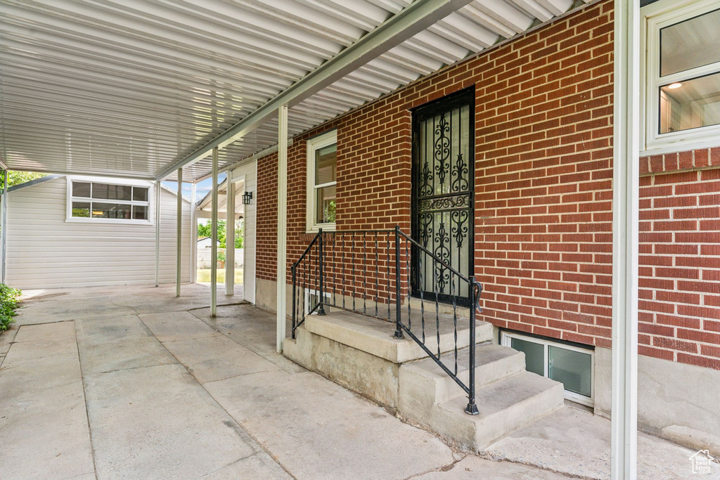 View of patio / terrace featuring a carport