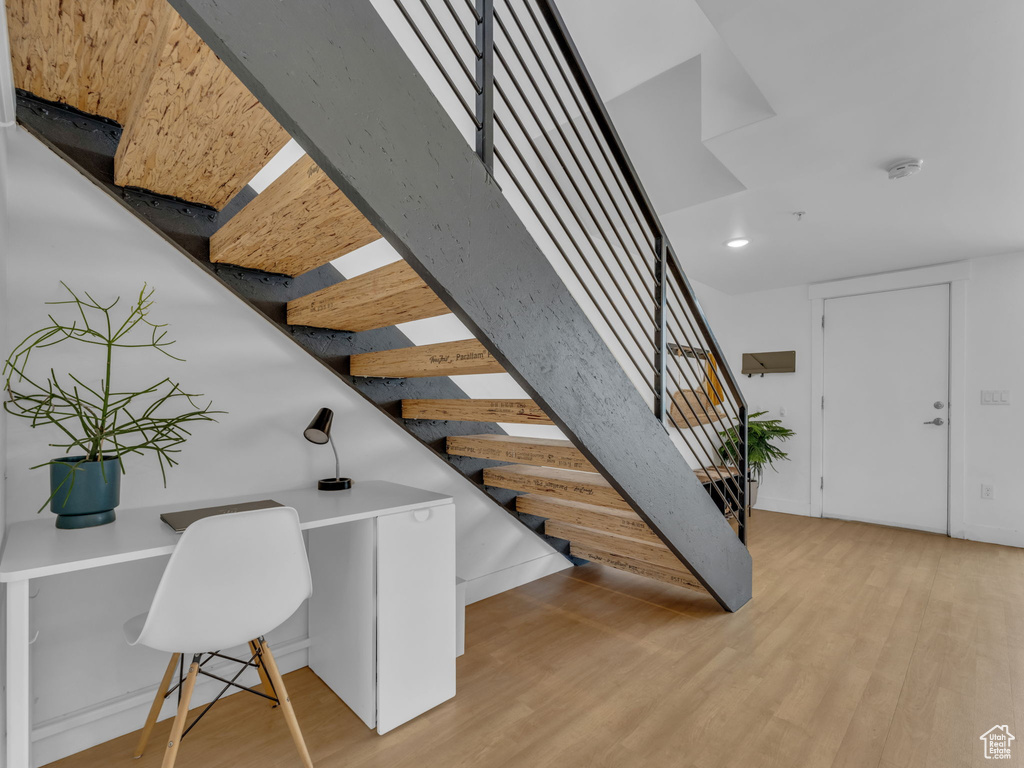 Staircase with wood finished floors