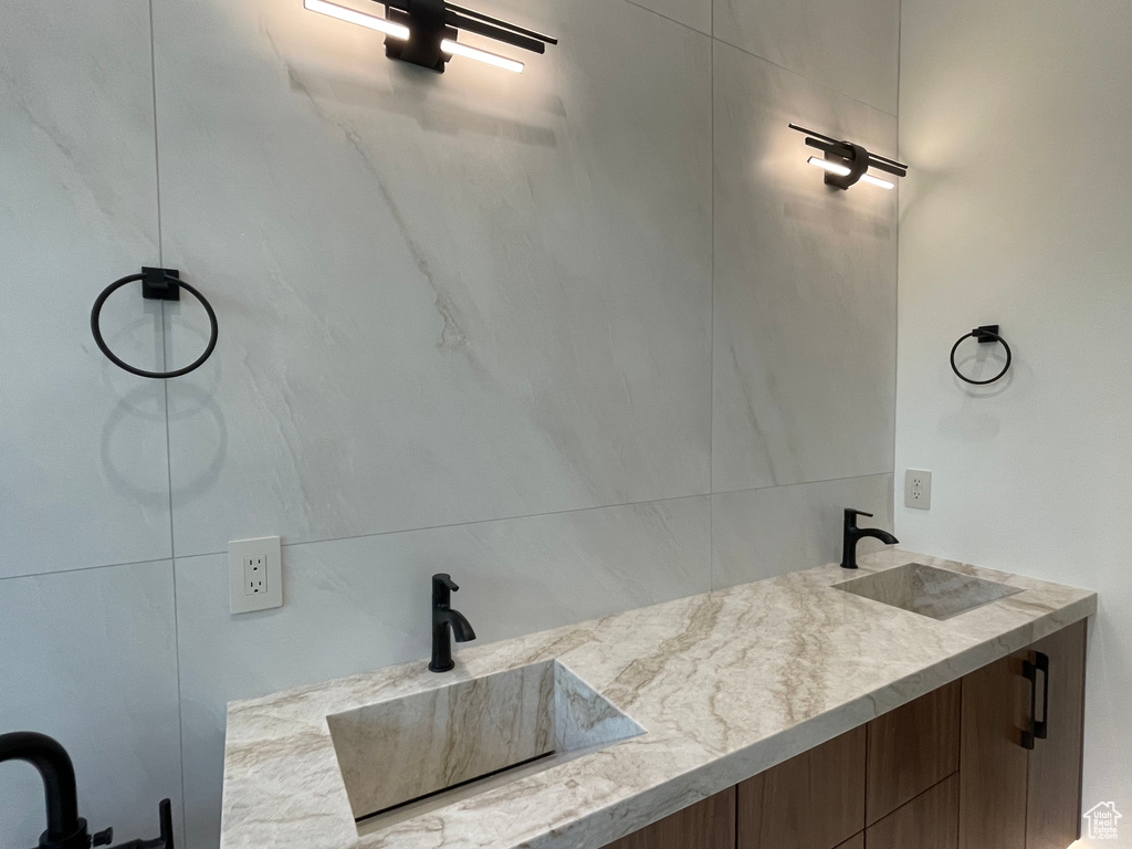 Bathroom featuring double vanity