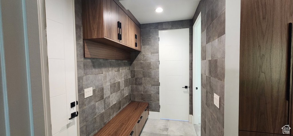 Mudroom with tile walls