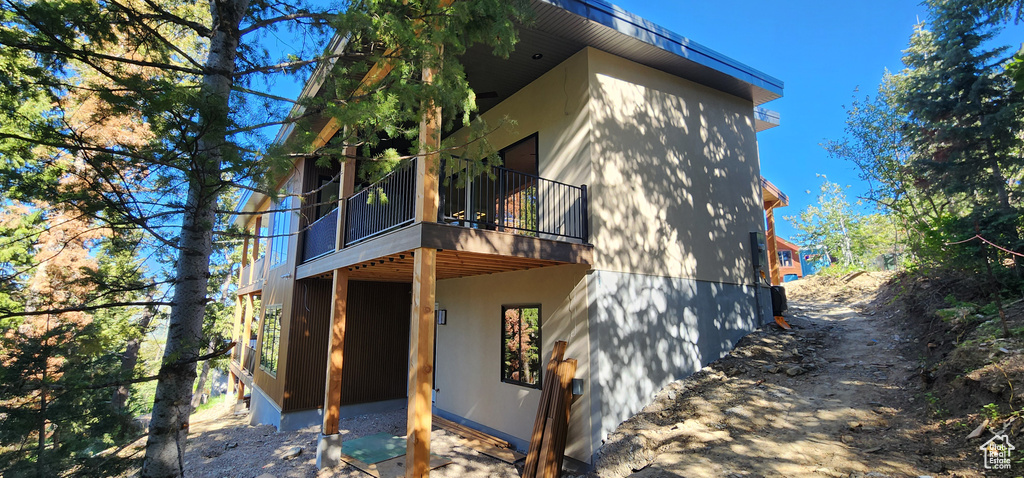 Rear view of property featuring a sunroom