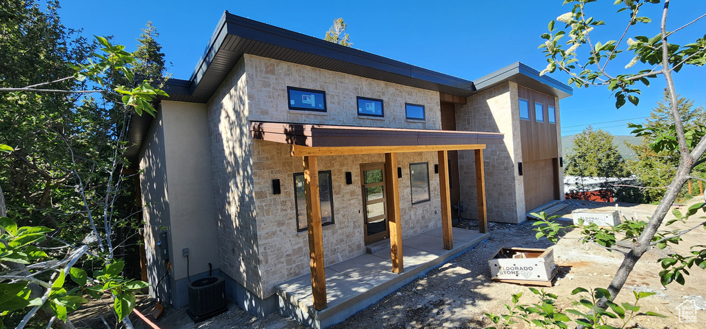 Back of property with central AC