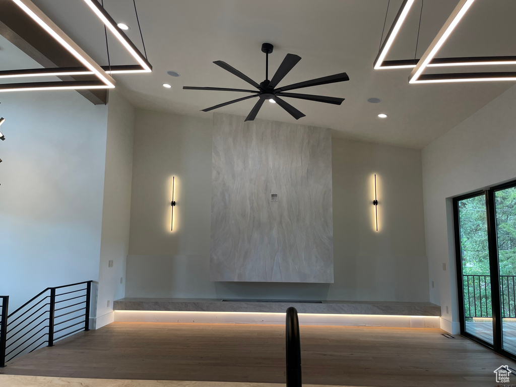 Hall featuring recessed lighting, wood finished floors, and baseboards