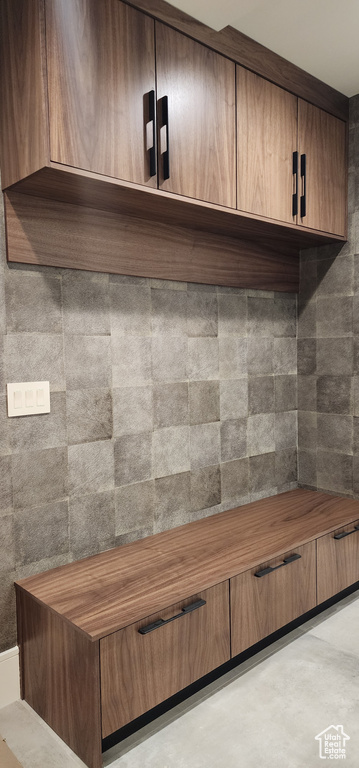 Mudroom with finished concrete flooring