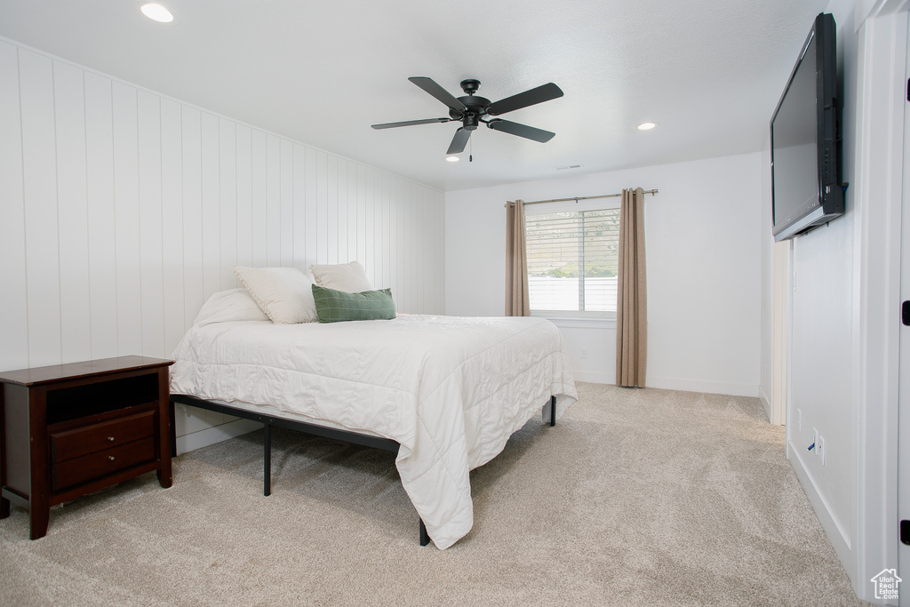 Bedroom featuring light colored carpet, recessed lighting, a ceiling fan, and baseboards