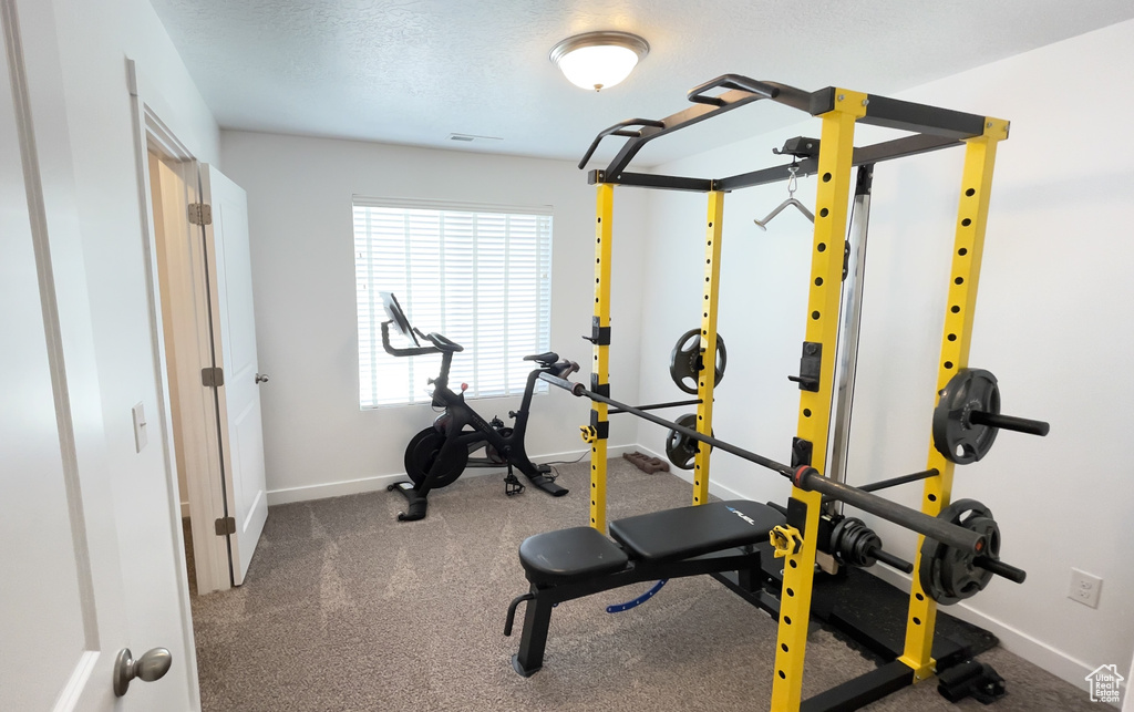 Exercise area featuring baseboards