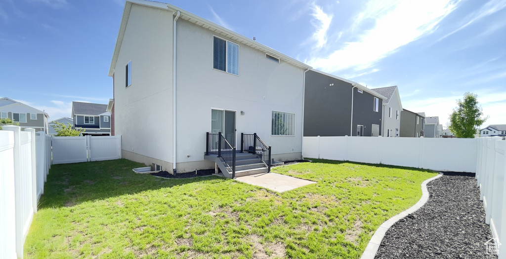 Back of house with a residential view and stucco siding