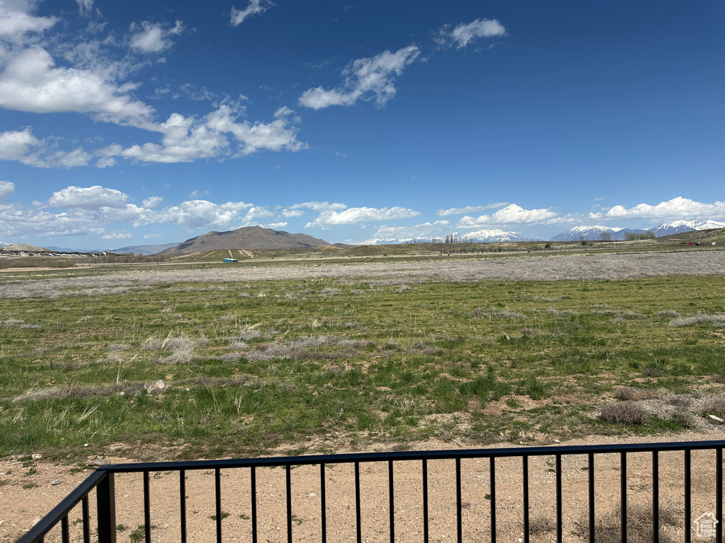 View of mountain background featuring rural landscape