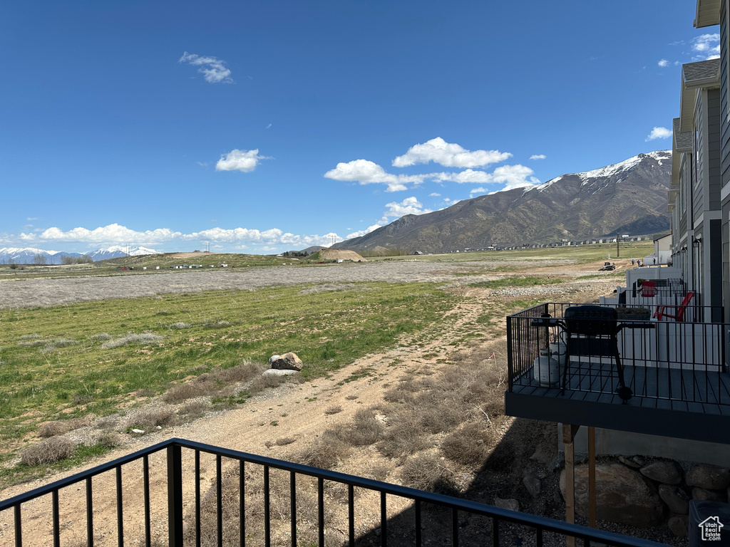 View of mountain backdrop with rural landscape