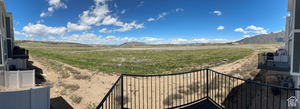View of yard with a mountain view and a view of rural / pastoral area