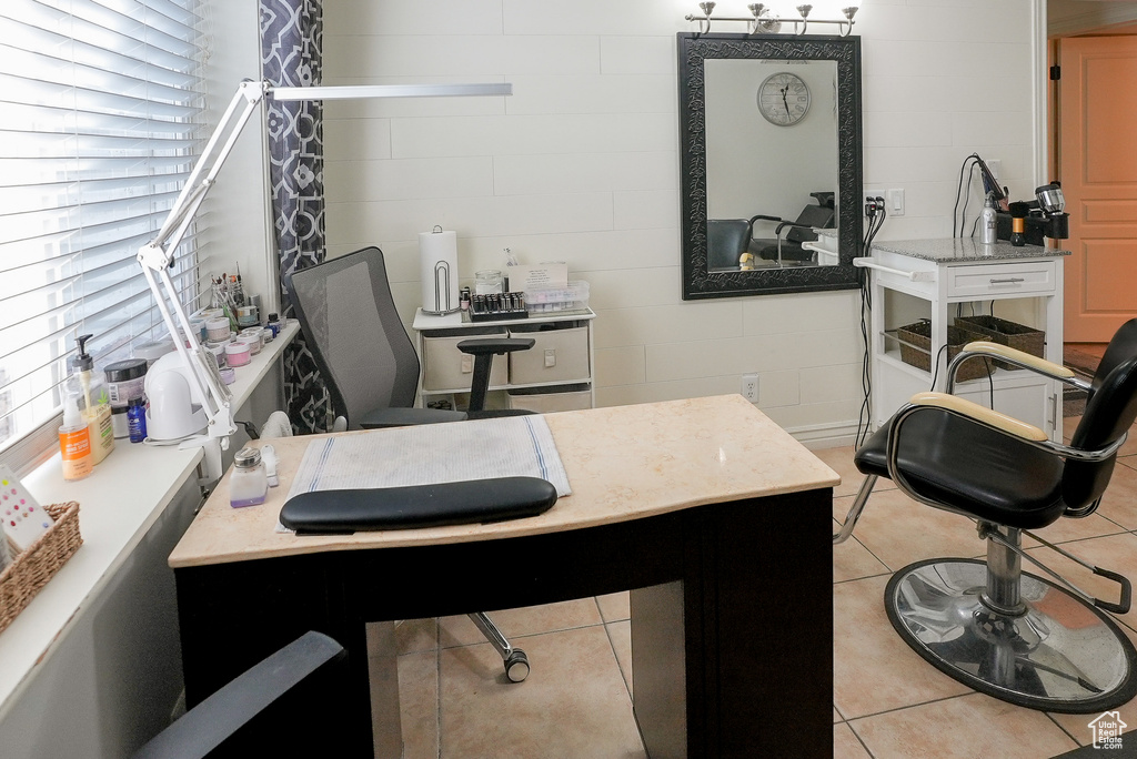 Office with light tile patterned floors