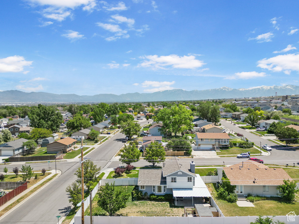 Aerial view of residential area with a mountainous background