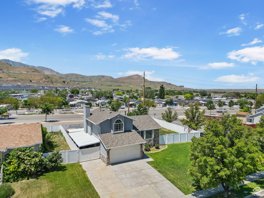 Aerial perspective of suburban area with a mountainous background